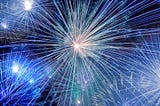 Time-lapsed photo of fireworks tinted blue