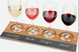 A flight of different wines.