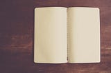 Blank pages of an opened notebook