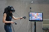 Woman uses virtual reality technology at a video demo