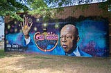 mural with john lewis and his famous phrase “good trouble”