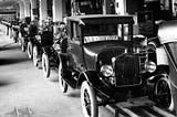 Row of Model T cars. Source: http://acabrerahistory12.weebly.com/uploads/8/8/0/9/8809455/9270329_orig.jpg