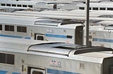 Parked trains in a train yard.