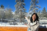 Abby in front of trees and snow