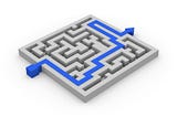 A grey maze with marked with a blue direction pathway from the entrance to the exit