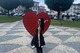 Monção — Portugal — Red Heart with a Smiling Girl in a black dress