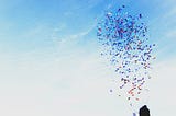 A photo of a woman releasing confetti