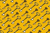 A bunch of old keys against a bright yellow background