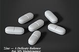 Black and white photo of white tablets, that reads, zinc - A delicate balance For MS Maintenance, on a black background.