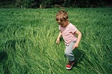 Emmet Abrussezze, 5, of County Wexford, Ireland, runs through the field in Rathnure, Ireland, on…