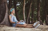 Grieving woman writing thoughts in her journal