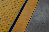 A close up of a yellow and black platform