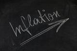 Inflation written in chalk on a blackboard