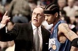 Coach Larry Brown talking to Allen Iverson on the sidelines.