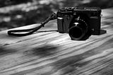 An X-Pro2 sitting on a picnic table.