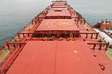 Orange colored massive holds of a cargo ship are shown