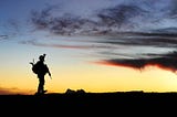 A silhouette of a soldier paying tribute