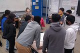 Levy meeting in a circle with eight students