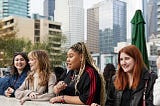 Photo of students with Los Angeles skyline in background.