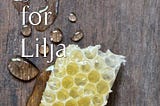 The cover image for Ryszard I. Merey’s novel A Father for Lilja, featuring a honeycomb and drops of honey against a wood background.