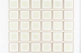 A grid arrangement of framed prints of grids on bright white paper.