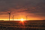 Sunset over a field of windmills