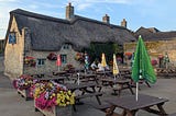 A thatched pub and beer garden