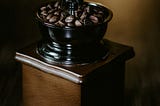 Coffee beans in a coffee grinder
