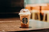 A Starbucks drink sitting on a table