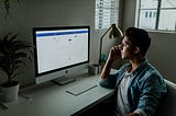 Man staring at computer screen