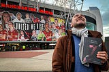 Karlo Tasler outside Old Trafford holding his book ‘Beyond Cristiano’