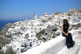 Wendy sitting in Santorini