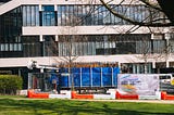 A drill, fenced off from the public, is pictured before a University of Leeds building