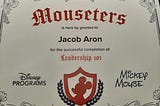 My “mouseters” certificate. It says “Mouseters is here by granted to Jake Aron for the successful completion of Leadership 101.” The certificate is signed by Mickey Mouse.