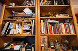 Image by the author, of the author’s bookshelf. Bonus points if you can actually identify how many hobbies/projects/careers are represented in these 8 shelves…
