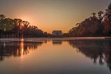 Photo of the Lincoln Memorial at sunset from a low angle over the water