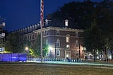 Photograph of campus flag at half staff for Charlie Kirk