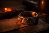 A crude iron ring with strange runes engraved on the sides.
