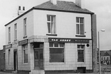Black-and-white photograph of the Old Abbey Taphouse.