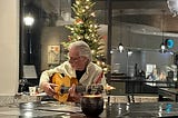 Winter night, the guitar player helps me remember