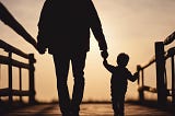 Father and son walking