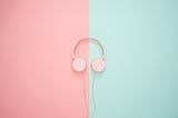 pink headphones on a pink and teal background