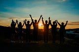 A group of friends looking at a sunset