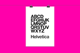 Black and white Helvetica typeset poster handing by two clips and set against a pink background
