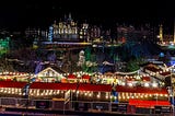 A night-time scene showing the Christmas market in Edinburgh.