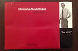 Data General brochure which is maroon and says “A generation ahead of the rest” and has a picture of my dad, a thin white man in his 30s standing on the side with his name underneath