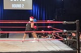 photo of a boxing fight in a boxing ring