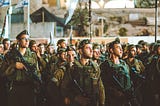 Group of Israeli soldiers stand at attention in Jerusalem
