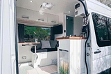 High-quality photo of well-designed van interiors, highlighting different styles and functionalities (e.g., minimalist, bohemian, rustic).