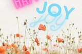 Happy Happy Joy Joy over a field of flowers.